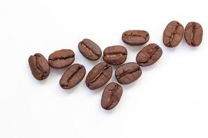 coffee beans arranged in a heart shape on a white background photo
