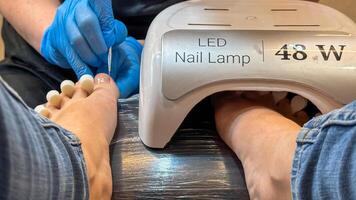 Pedicure magic under LED glow, a rejuvenating spa for toes, self care ritual, echoing Lunar New Year renewal photo