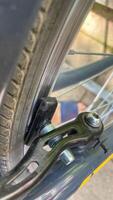 Tire and brake symphony in a metallic embrace, capturing Earth Days cycling dreams and the art of kinetic silence photo
