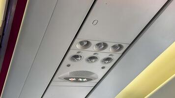 Glimmering aircraft ceiling panels echo futuristic voyages, celebrating Aviation Day and World Tourism Day with metallic serenity photo