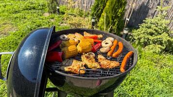 Summer barbecue bliss, sizzling cornucopia of grilled delights under azure skies, celebrates Midsummer and the unconventional Rotisserie Day photo