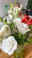 Delicate white lisianthus and fiery red gerbera bouquet, blooming serenade, Imbolc floral magic, multicultural unity, vibrant solstice photo