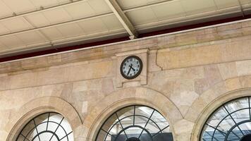 Antique railway clock echoes times whispers, stone arches hold secrets of bygone journeys, resonating with Railway Heritage Day nostalgia photo