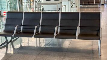 Vacant airport seating whispers tales of transient souls and restless wanderers, resonating with World Tourism Day and Jet Lag Awareness Week photo