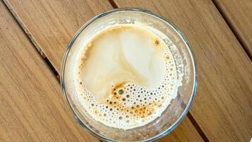 Effervescent latte topography swirls in a glass, invoking National Coffee Day zen, echoing hygge and artisan espresso craftsmanship photo