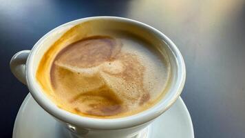 Velvety crema crowns the steaming espresso, evoking warm conversations on International Coffee Day, with hints of caffeine alchemy photo