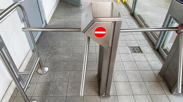 Rogue turnstile exudes metallic defiance during Empty Gates Festival, symbolizing urban transits quiet rebellion and clandestine thresholds photo