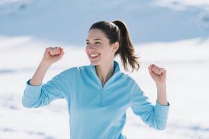 A woman is running in the snow photo