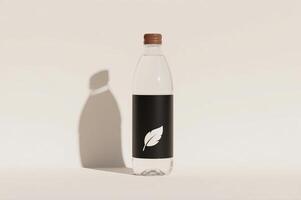 A bottle of water with a leaf on it photo