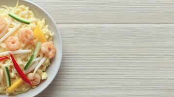 Fresh Shrimp Salad with Vegetables on White Plate, Healthy Seafood Dish with Lime and Garnishes, Delicious Light Meal for Lunch or Dinner photo