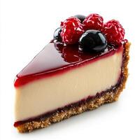A piece of cheesecake with berries on top photo