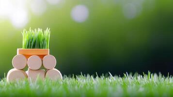 Eco friendly planting container composed of wooden blocks and vibrant green grass sprouts growing outdoors on a sunny day with blurred nature background photo