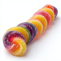 Colorful rainbow gummy candies coiled in a spiral with sugar coating on a white background, vibrant sweet treats ideal for snacking, parties, or celebrations photo