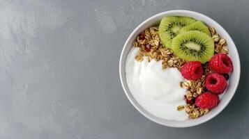 Healthy Yogurt Parfait with Granola, Kiwi, and Raspberries photo