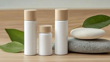 three bottles with white caps and green leaves photo