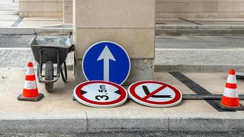 Urban symphony of abandoned signs and cones, symbolizing roadside zen, driving meditation, and Infrastructure Week contemplation photo