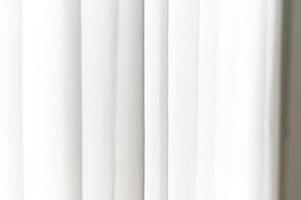 White light and soft subtle shadow create gentle vertical gradient texture, forming clean background. minimal pattern plain surface shows elegant lines and curves, providing simple decor photo