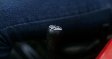 Close up of a male hairy hand shifting the gear lever of a modern agricultural machine, a man's face is not in the frame, an unrecognizable person photo