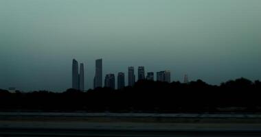 Panoramic view of metropolis with modern skyscrapers. from a moving car window, general view of the city photo