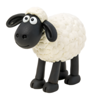 A clay sculpture of a black sheep with white fur. It is standing with its eyes wide open. png