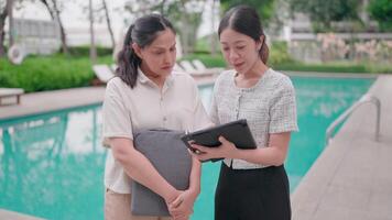 Agents will talk to clients about the property's offers near the sparkling pool, which showcases the luxury and tranquility of the residence. video