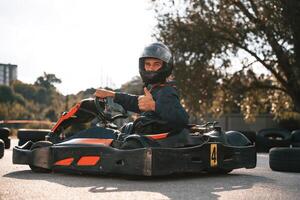 Trees ,and, sunlight.. Man is outdoors, kart racing conception photo