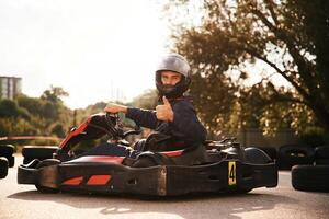 Trees and sunlight. .,Man is outdoors, kart racing conception photo