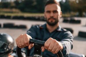 Competition, riding. Man ,is outdoors, kart racing conception photo
