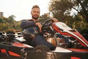 Trees ,and sunlight. Man is outdoors, kart racing conception photo