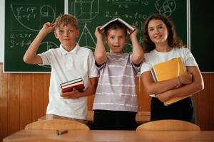 Having,, fun, on a break time. Pupils,, kids in the classroom together photo