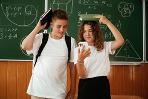 Having fun, on a break time. Pupils, kids in the classroom together photo
