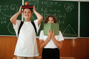Having, fun on a break time. Pupils, kids in the classroom together photo