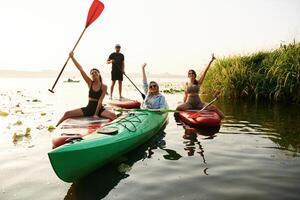 On the lake. .Friends are together on sup boards photo