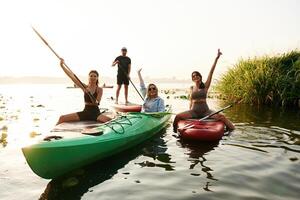 On, the lake... Friends ,are together on sup boards photo