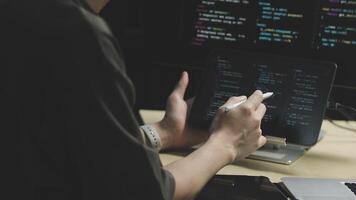 A person is working on a laptop with code on the screen video