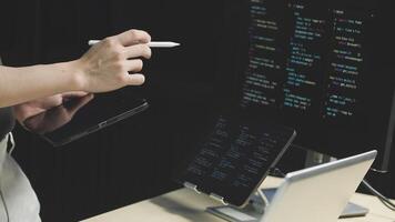 A person is using a pen to write on a computer screen video