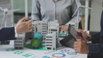 Business people working on a project with paper models video