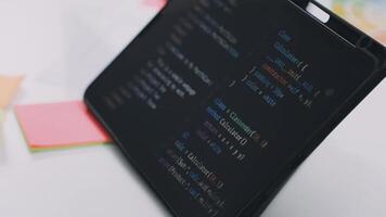 A tablet with a programming code on it video