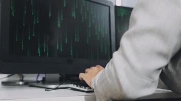 A person typing on a computer screen with binary code on it video