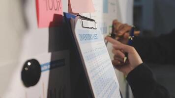 A person is holding a clipboard with sticky notes video