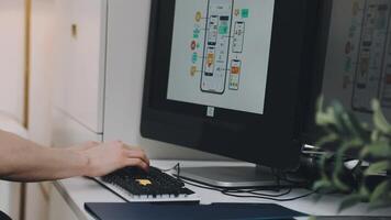 A person is typing on a keyboard in front of a computer video