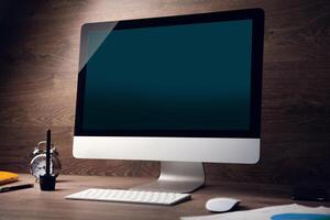 A computer monitor sitting on a desk photo