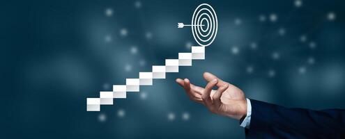 A hand is pointing to a target on a stairway photo