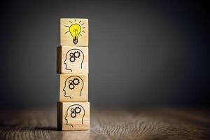 A wooden block with a light bulb on top of it photo