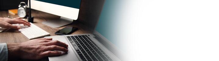 A person typing on a computer keyboard photo