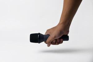 Man hand with microphone isolated on white photo