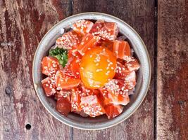 Japanese rice with fresh salmon raw and raw eggs photo