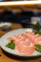 Sliced pork for make sukiyaki or shabu photo