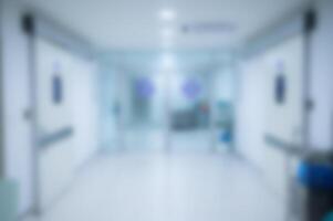 Blurred image shot of an empty corridor to operating room in hospital. photo