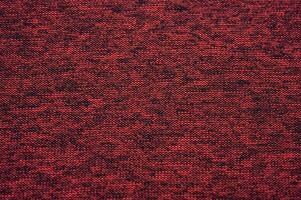 Full frame shot of red recycled polyester cloth texture and background. photo